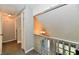 Hallway view featuring an open balcony with a stylish chandelier in a charming home at 260 Christina Dr, Whiteland, IN 46184