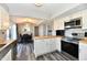 Kitchen boasts a dining area, white cabinets, stainless appliances, and butcher block countertops at 260 Christina Dr, Whiteland, IN 46184