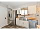Modern kitchen with stainless steel appliances, a farmhouse sink, white cabinets, and butcher block countertops at 260 Christina Dr, Whiteland, IN 46184