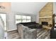 Bright living room featuring a stone fireplace, a modern sectional, and an open entrance at 260 Christina Dr, Whiteland, IN 46184