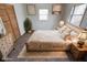 Cozy bedroom with neutral tones, soft textures, decorative art, and natural light at 268 E Hoover Dr, Princess Lakes, IN 46164