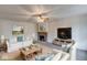 Cozy living room featuring a fireplace, comfortable seating, and natural light at 268 E Hoover Dr, Princess Lakes, IN 46164