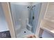 Modern white shower stall with built-in seating and hand-held shower head at 268 E Hoover Dr, Princess Lakes, IN 46164