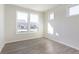 Bright bedroom featuring wood-look flooring, neutral walls and trim, and several windows allowing for ample natural light at 2766 Ruffian Dr, Westfield, IN 46074