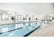 Bright indoor pool with clear water, large windows, and spa at 2766 Ruffian Dr, Westfield, IN 46074
