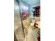 This bathroom has a tub and shower, with interesting artwork on the wall at 2804 Paso Del Norte Dr, Indianapolis, IN 46227