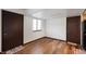 The bedroom features light walls, wood floors, a large window and two closets with doors at 2804 Paso Del Norte Dr, Indianapolis, IN 46227