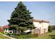 Exterior view of home with a large tree in the yard and mature landscaping at 2804 Paso Del Norte Dr, Indianapolis, IN 46227