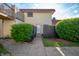 A townhome's front entrance shows a walkway, mature landscaping, and a security door at 2804 Paso Del Norte Dr, Indianapolis, IN 46227