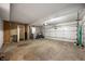 Spacious garage featuring concrete floor, a motorcycle, and white garage door at 2804 Paso Del Norte Dr, Indianapolis, IN 46227