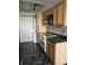 Well-lit kitchen featuring light wood cabinets and white appliances at 2804 Paso Del Norte Dr, Indianapolis, IN 46227