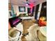 Living room area with wood floors and brightly decorated with colorful furniture at 2804 Paso Del Norte Dr, Indianapolis, IN 46227