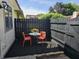 A private patio featuring outdoor seating and a decorative black fence at 2804 Paso Del Norte Dr, Indianapolis, IN 46227