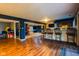 Finished basement featuring a bar area with bar stools and open entertaining space at 3037 Santiago Dr, Greenwood, IN 46143