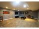 Finished basement features a large living space with TV, coffee table, and decorative accents at 3037 Santiago Dr, Greenwood, IN 46143