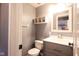 Small bathroom features a vanity with sink, mirror, toilet and modern fixtures and lighting at 3037 Santiago Dr, Greenwood, IN 46143