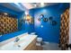 Vibrant bathroom features a vanity with sink, toilet, mirror, and a decorative shower curtain at 3037 Santiago Dr, Greenwood, IN 46143