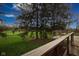 Wide shot of a wooden deck overlooking a green golf course at 3037 Santiago Dr, Greenwood, IN 46143