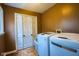 Laundry room featuring a washing machine, dryer, closet and natural light coming in through a window at 3037 Santiago Dr, Greenwood, IN 46143