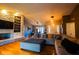 Bright open-concept living room flows into dining area, featuring a stone fireplace and modern finishes at 3037 Santiago Dr, Greenwood, IN 46143
