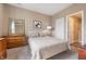 Guest bedroom with neutral colors, a dresser, and a comfortable queen-size bed at 315 Limerick Ln, Pendleton, IN 46064