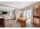 Sunlit dining area with hardwood floors, stylish chandelier, and easy access to the outdoor patio at 315 Limerick Ln, Pendleton, IN 46064