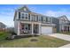 Beautiful two-story home with a front porch swing and manicured lawn at 315 Limerick Ln, Pendleton, IN 46064