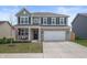 Charming two-story home with a two-car garage, covered front porch, and a swing at 315 Limerick Ln, Pendleton, IN 46064