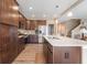 Modern kitchen with stainless steel appliances, dark wood cabinets, and a kitchen island at 315 Limerick Ln, Pendleton, IN 46064