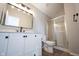 Bathroom with white vanity, black hardware, framed mirror and glass shower at 3260 Eddy Ct, Indianapolis, IN 46214