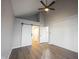 This bedroom has a vaulted ceiling, gray walls, white shiplap, and a barn door to a walk-in closet at 3260 Eddy Ct, Indianapolis, IN 46214