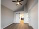 This bedroom has a vaulted ceiling, gray walls, white shiplap, and doorways to the closet and bathroom at 3260 Eddy Ct, Indianapolis, IN 46214