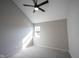 A gray bedroom featuring a ceiling fan, window, and gray carpet at 3260 Eddy Ct, Indianapolis, IN 46214