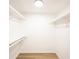 Walk-in closet featuring painted walls, wood floor and closet rods at 3260 Eddy Ct, Indianapolis, IN 46214