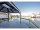 Enjoy waterfront views from the covered deck with sleek railings, perfect for relaxing and entertaining guests by the water at 3260 Eddy Ct, Indianapolis, IN 46214