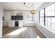 Stylish dining area with a modern bar, wine storage, and a large window that provides ample natural light at 3260 Eddy Ct, Indianapolis, IN 46214