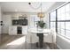 Stylish dining area with a modern bar, wine storage, and a large window that provides ample natural light at 3260 Eddy Ct, Indianapolis, IN 46214