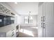 The dining area with white cabinets features a built-in wine fridge, wine rack, and views to the window at 3260 Eddy Ct, Indianapolis, IN 46214