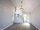 Bright foyer with high ceilings, a modern chandelier, and elegant staircase, creating a grand and welcoming entrance at 3260 Eddy Ct, Indianapolis, IN 46214