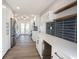 Contemporary kitchen features white cabinetry, quartz countertops, stainless steel appliances, and subway tile backsplash at 3260 Eddy Ct, Indianapolis, IN 46214