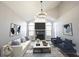Bright living room featuring vaulted ceilings, a cozy fireplace, neutral tones, and stylish decor for comfortable living at 3260 Eddy Ct, Indianapolis, IN 46214