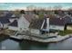 Waterfront home with deck, gazebo, and hot tub overlooking calm water, providing serene outdoor living at 3260 Eddy Ct, Indianapolis, IN 46214