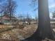 Large backyard with mature trees and a detached garage at the back of the property at 3844 Esquire Ct, Indianapolis, IN 46226