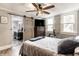 Lovely bedroom with en suite bathroom, a ceiling fan, and lots of natural light from two bright double windows at 421 S East St, Plainfield, IN 46168