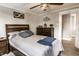Inviting bedroom featuring a ceiling fan, soft neutral walls, and wood floors, creating a serene retreat at 421 S East St, Plainfield, IN 46168