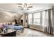 Cozy bedroom with natural light from the windows, with a ceiling fan and a neutral color palette at 421 S East St, Plainfield, IN 46168