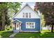 Charming two-story home with a blue exterior, well-maintained lawn, and inviting front porch at 421 S East St, Plainfield, IN 46168