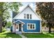 Charming two-story home with a blue exterior, well-maintained lawn, and inviting front porch at 421 S East St, Plainfield, IN 46168