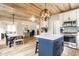 Open concept view of the kitchen, dining room, and office space with wood floors and white kitchen cabinets at 421 S East St, Plainfield, IN 46168