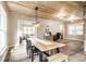 Open-concept living space with a dining table, wood ceiling, and home office setup at 421 S East St, Plainfield, IN 46168